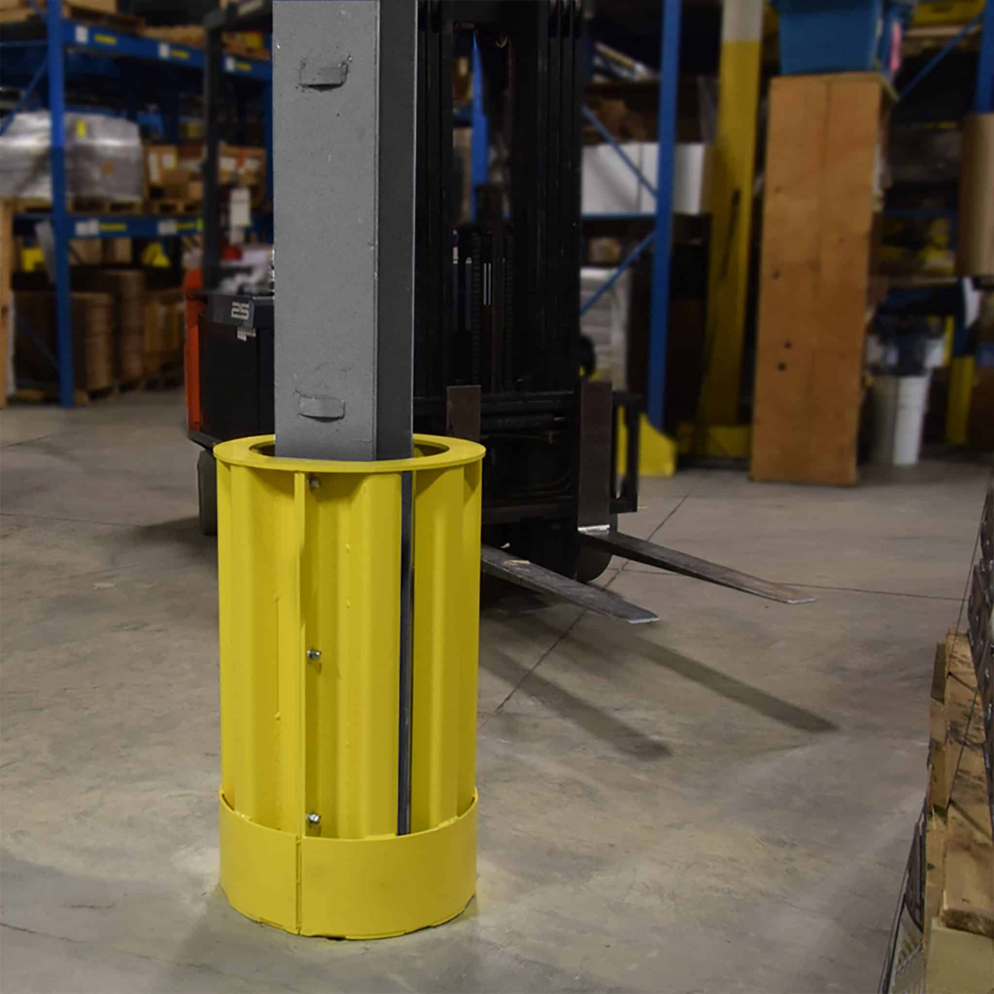 Yellow safety bollards protecting warehouse interior and equipment.